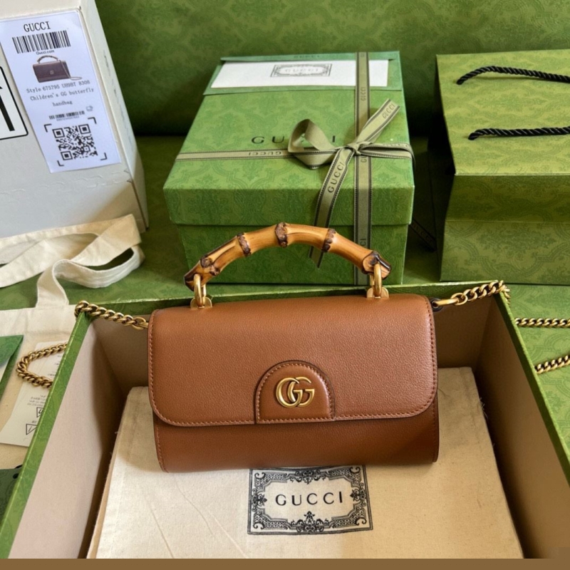 G*u*i top handle bags